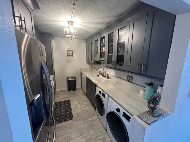 a bathroom with double vanity sink and a mirror