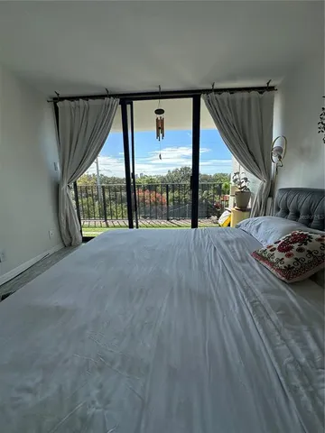 a view of a room with a large window