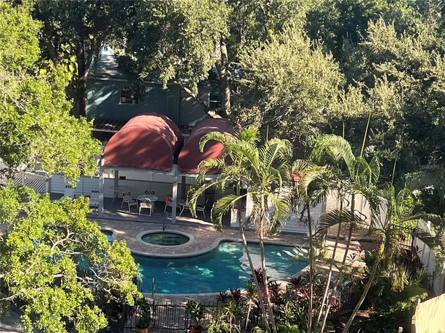 a bathroom with a granite countertop sink a toilet and a bathtub
