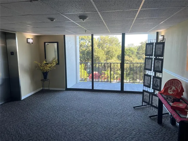 a view of livingroom with furniture and floor to ceiling window