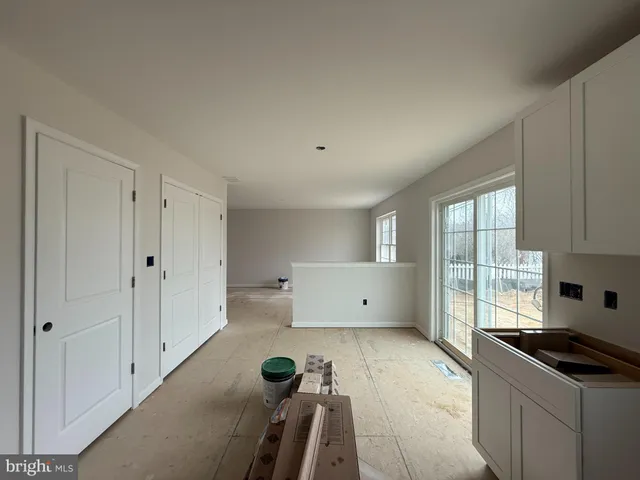 a kitchen with granite countertop a stove and a refrigerator