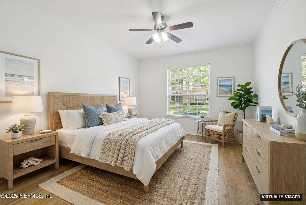 7990 Baymeadows Road East, Unit 201 Jacksonville, FL 32256 - Photo 13 of 43 a bedroom with a bed and a large window