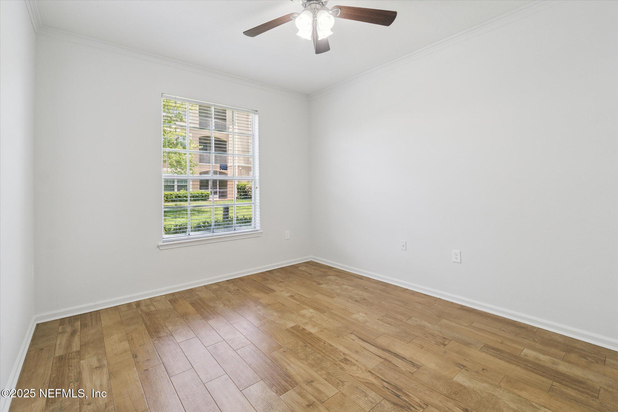 7990 Baymeadows Road East, Unit 201 Jacksonville, FL 32256 - Photo 14 of 43 an empty room with a window