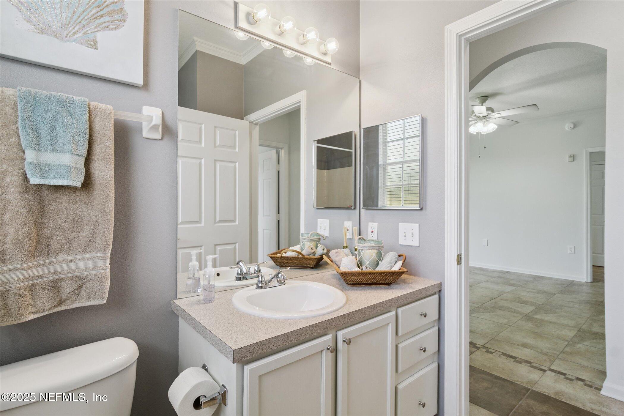 7990 Baymeadows Road East, Unit 201 Jacksonville, FL 32256 - Photo 20 of 43 a bathroom with a sink double vanity and a mirror
