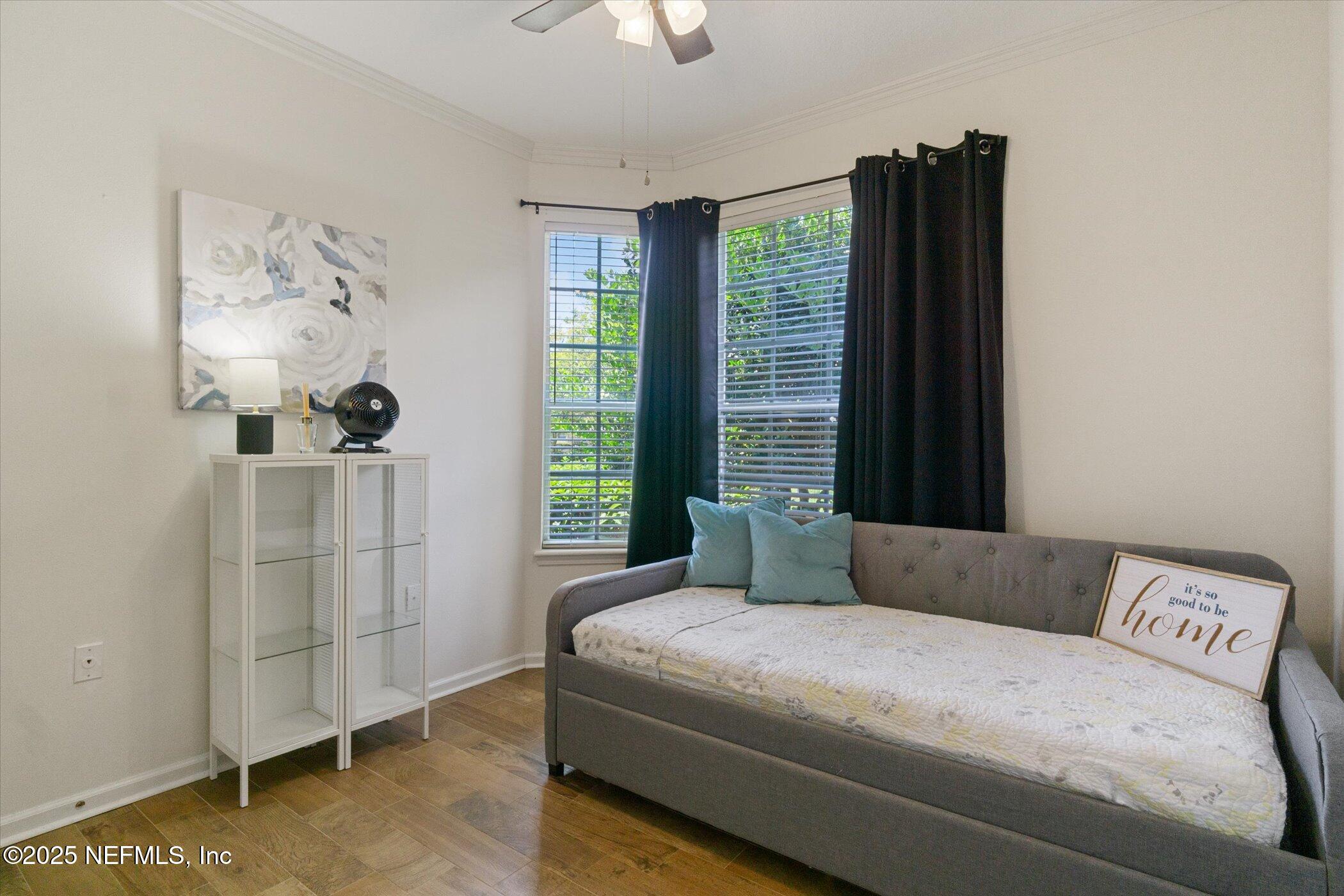7990 Baymeadows Road East, Unit 201 Jacksonville, FL 32256 - Photo 23 of 43 a living room with furniture and a window