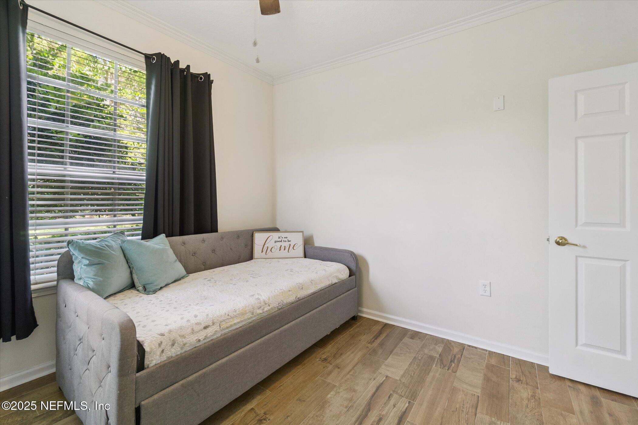 7990 Baymeadows Road East, Unit 201 Jacksonville, FL 32256 - Photo 24 of 43 a bedroom with a bed and a window