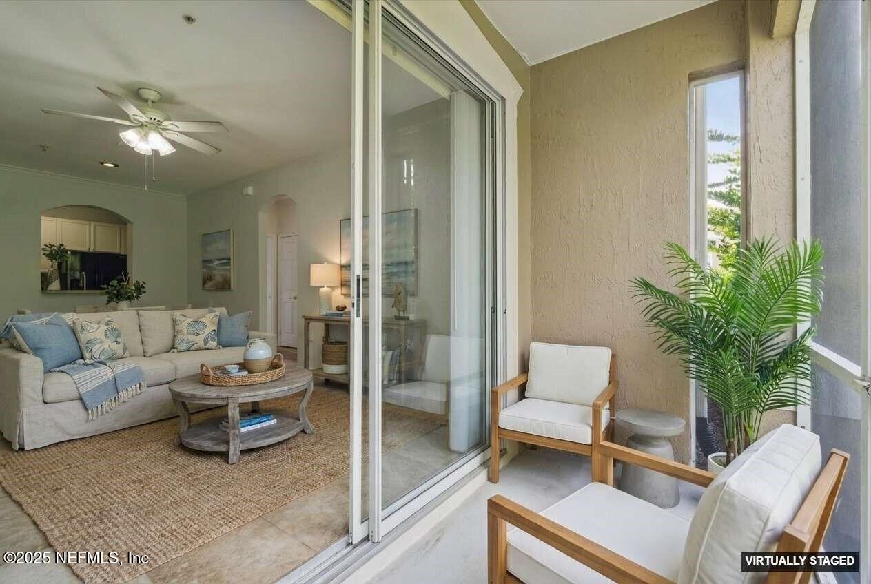 7990 Baymeadows Road East, Unit 201 Jacksonville, FL 32256 - Photo 25 of 43 a living room with furniture and a potted plant