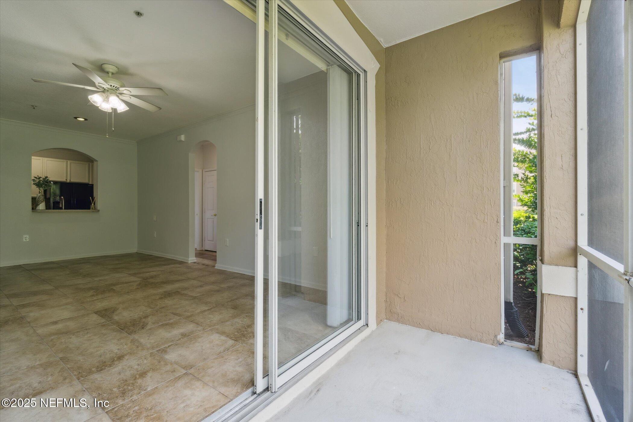 7990 Baymeadows Road East, Unit 201 Jacksonville, FL 32256 - Photo 26 of 43 a view of an empty room and chandelier fan