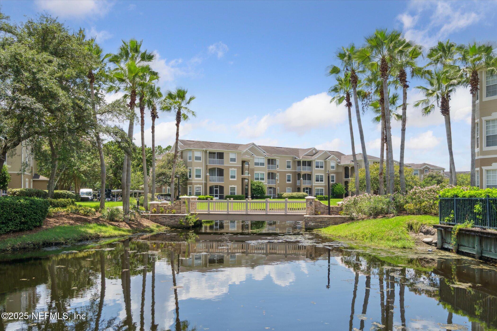 7990 Baymeadows Road East, Unit 201 Jacksonville, FL 32256 - Photo 33 of 43 a view of swimming pool with outdoor seating and plants