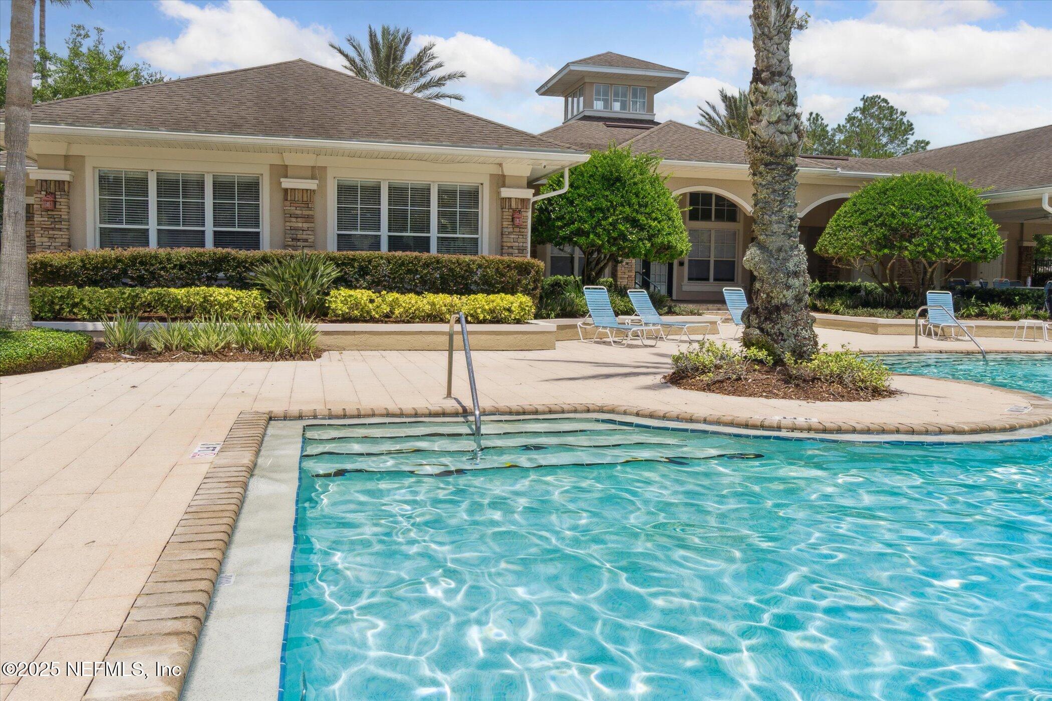 7990 Baymeadows Road East, Unit 201 Jacksonville, FL 32256 - Photo 34 of 43 a view of a house with garden and plants