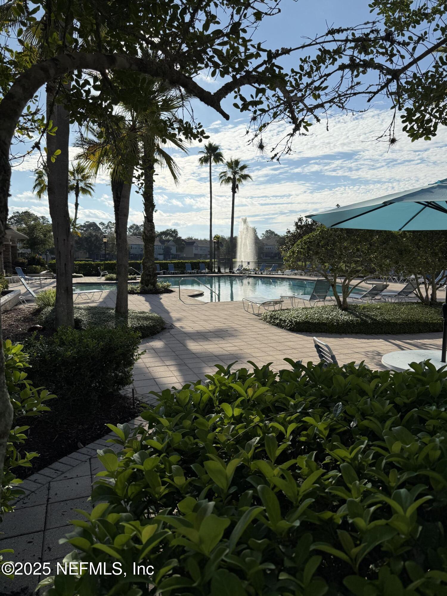 7990 Baymeadows Road East, Unit 201 Jacksonville, FL 32256 - Photo 40 of 43 a view of a pathway with a wrought fence
