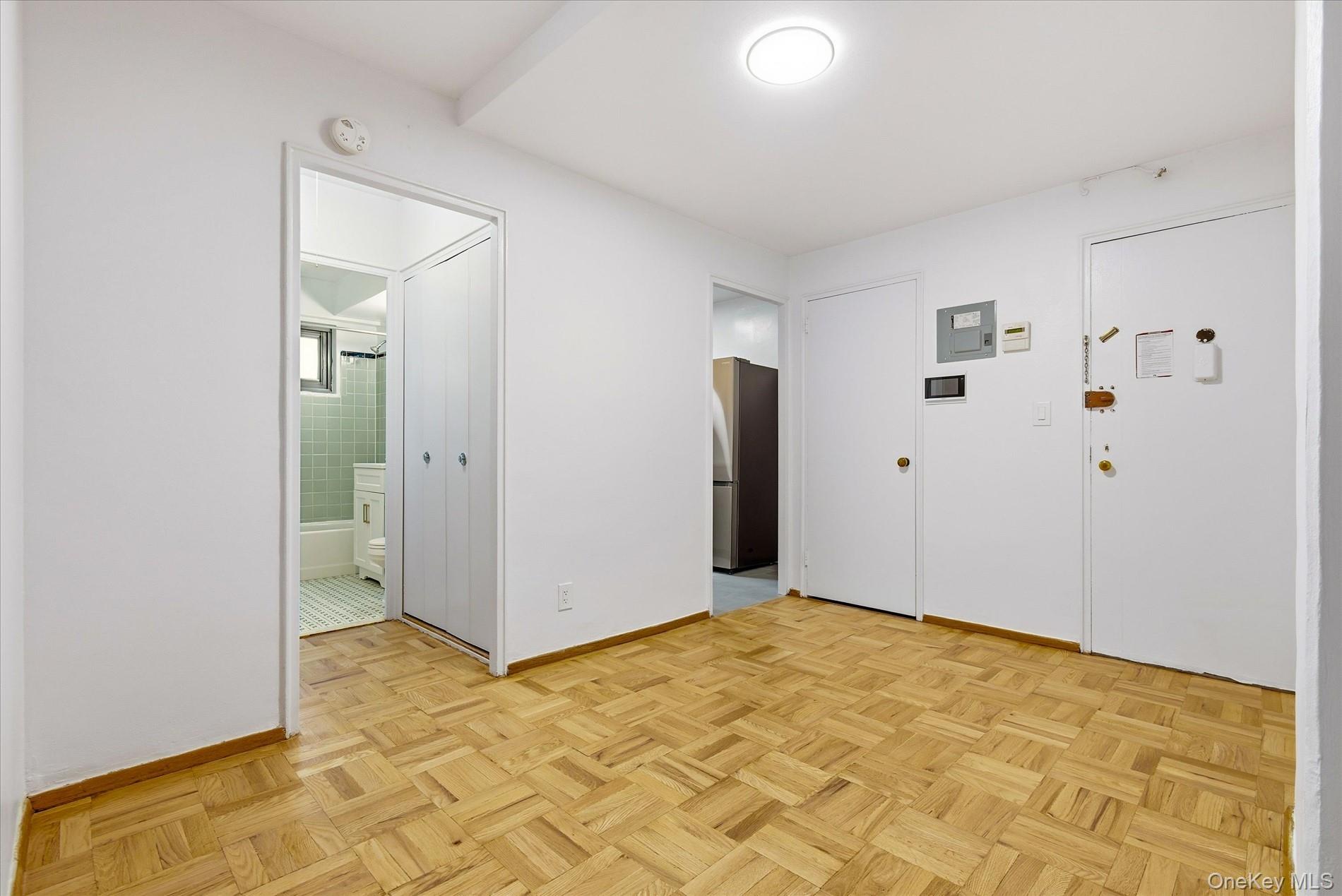 21-85 34th Avenue, Unit 2D Queens, NY 11106 - Photo 5 of 17 Foyer featuring baseboards