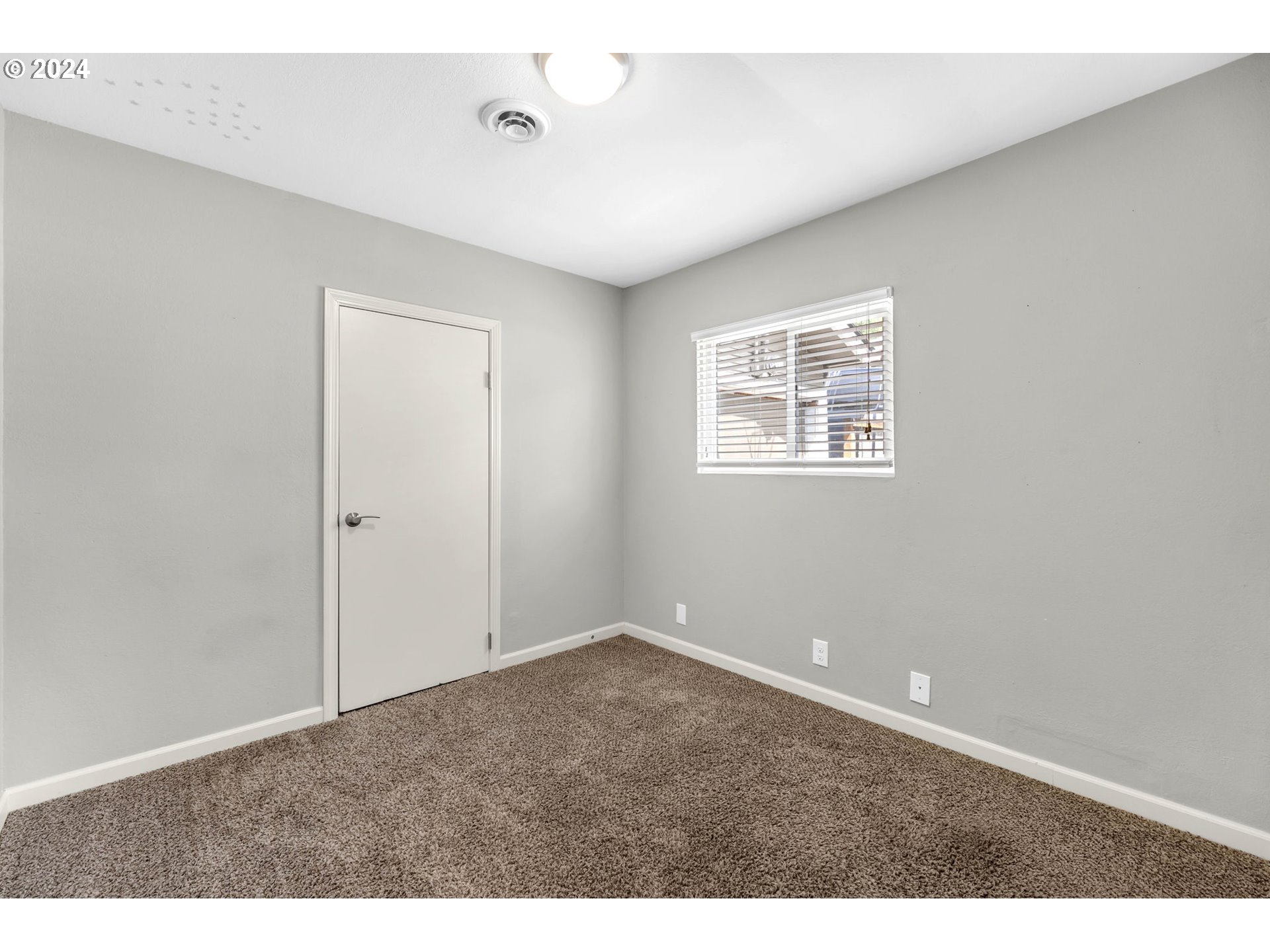 825 Northwest Greeley Street Camas, WA 98607 - Photo 18 of 27 a view of an empty room with a window