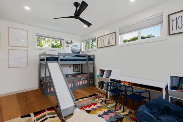 a bed room with furniture and a window