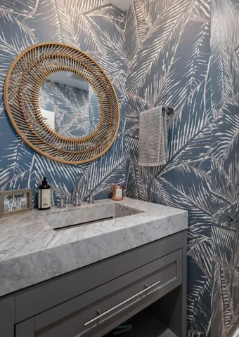 a close up of a sink with granite countertops
