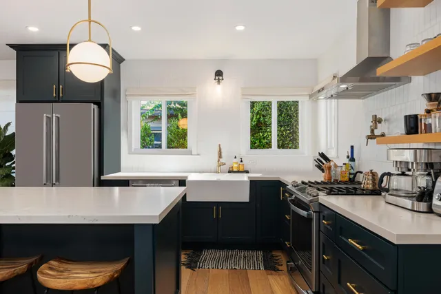 a kitchen with a sink cabinets and window