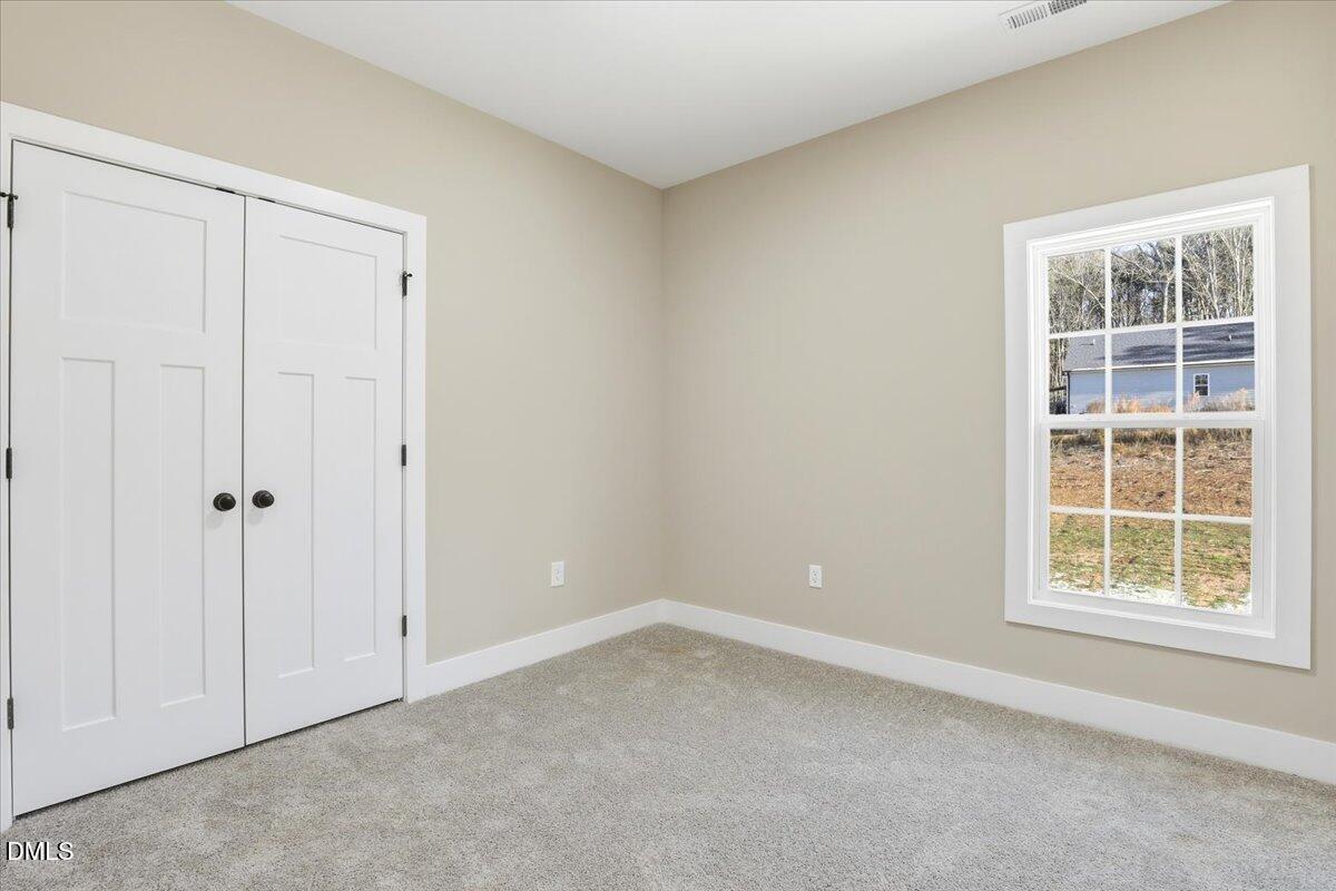 358 Natchez Trace Fuquay-Varina, NC 27526 - Photo 11 of 26 an empty room with a window
