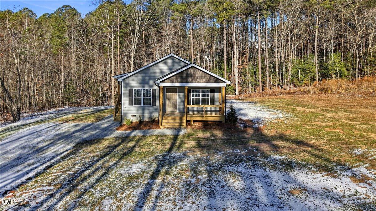 358 Natchez Trace Fuquay-Varina, NC 27526 - Photo 22 of 26 a view of a house with a yard balcony and wooden fence