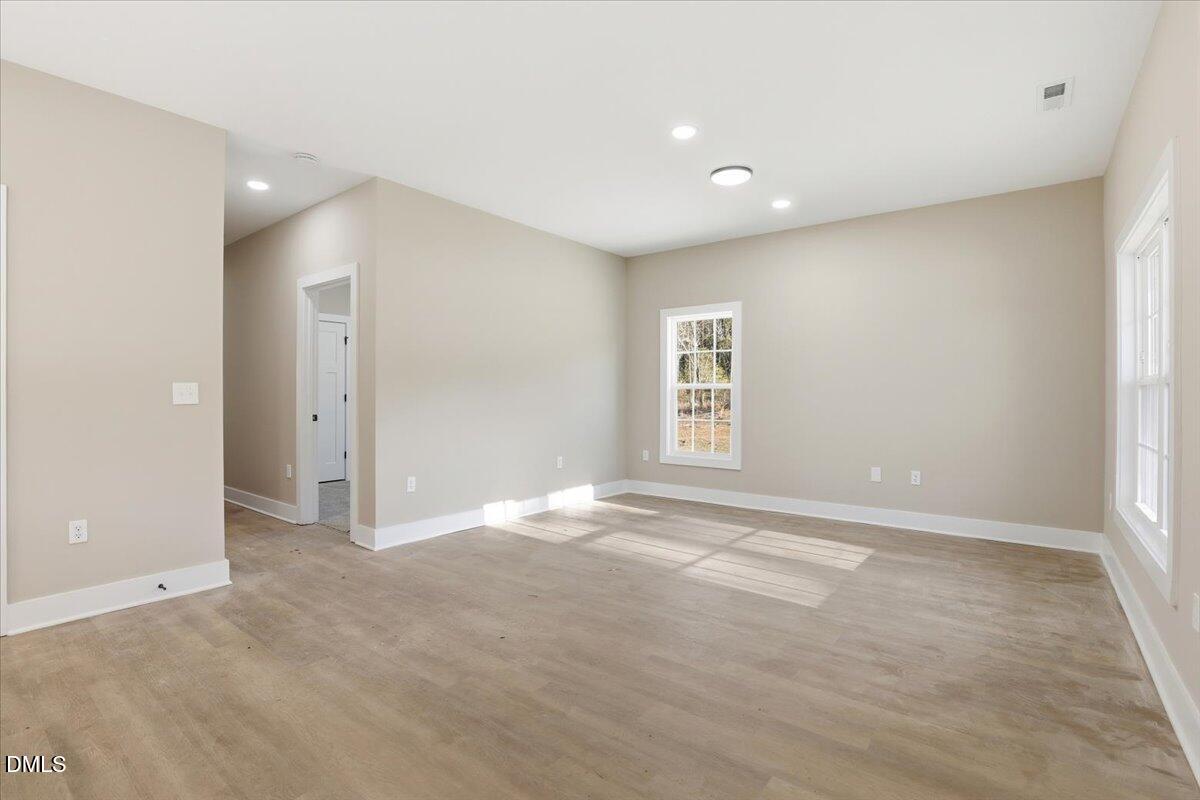 358 Natchez Trace Fuquay-Varina, NC 27526 - Photo 10 of 26 an empty room with windows and closet