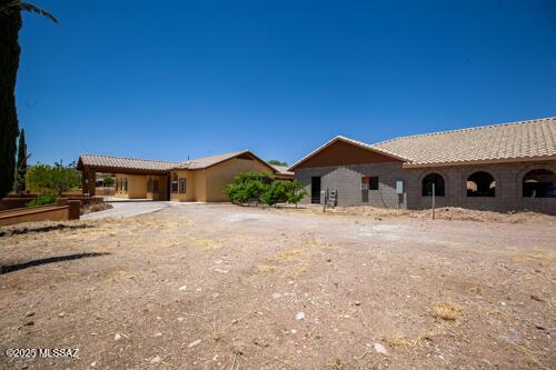 480 Camino Ramanote Rio Rico, AZ 85648 - Photo 25 of 43 Front view facing south of house and workshop from southwest and spacious parking to right of drive available.