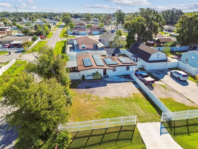 an aerial view of residential houses with outdoor space