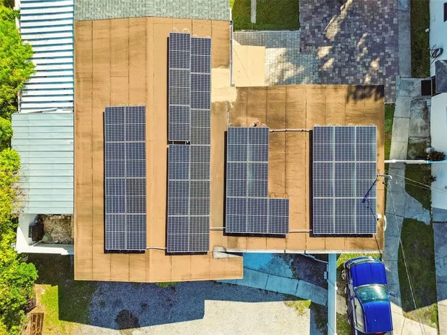 a kitchen with granite countertop a refrigerator sink and cabinets