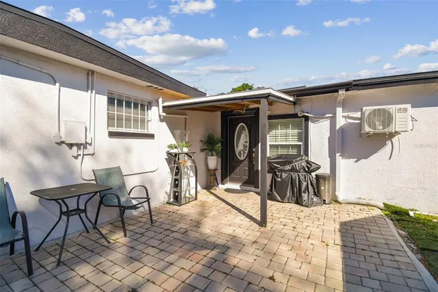 a kitchen with stainless steel appliances a stove a sink a microwave and a refrigerator