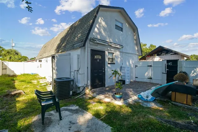 an aerial view of residential houses with outdoor space and river