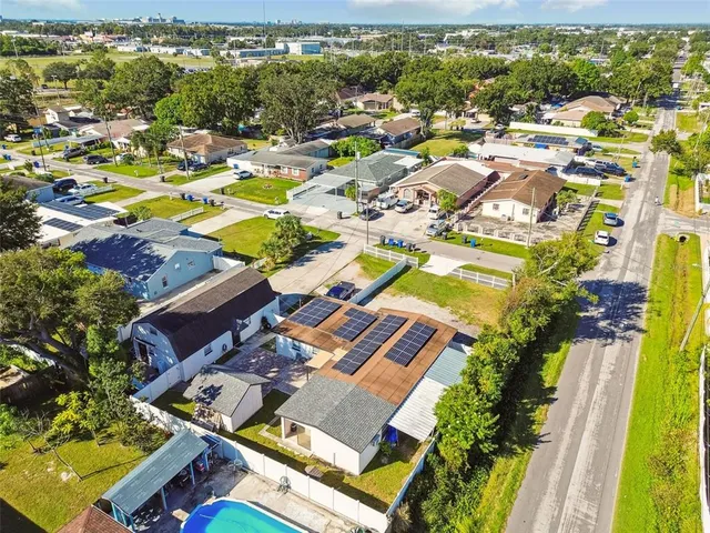 a view of a tennis ground with a pool