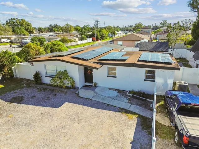 a kitchen with stainless steel appliances a refrigerator sink and cabinets