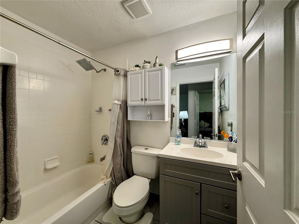 408 Raymond Street Minneola, FL 34715 - Photo 21 of 40 a bathroom with a sink toilet tub and shower