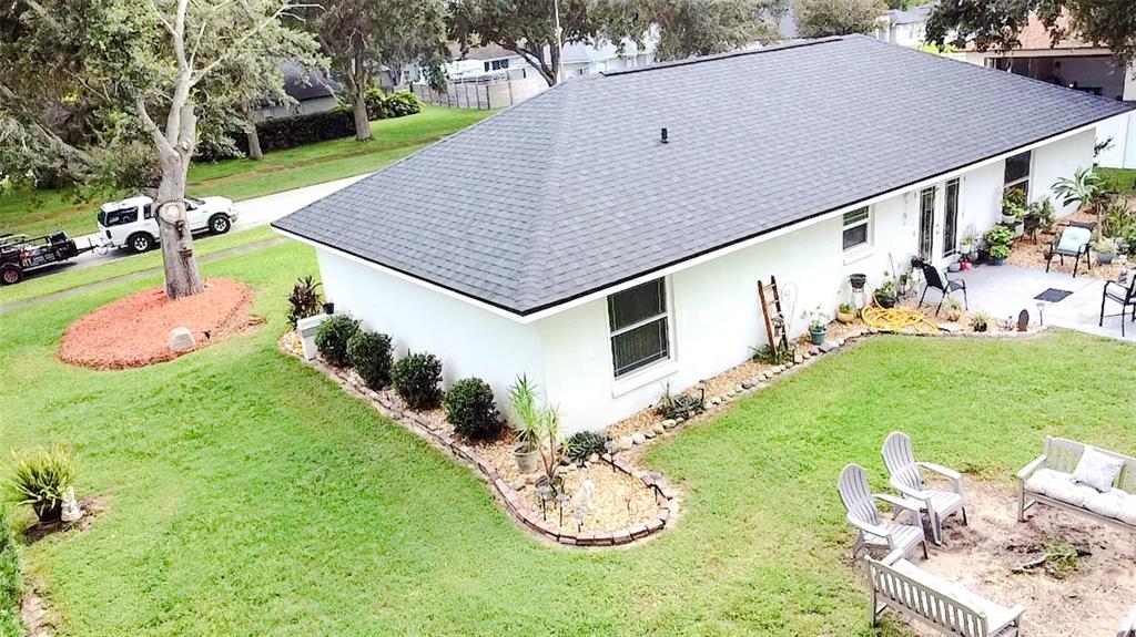 408 Raymond Street Minneola, FL 34715 - Photo 39 of 40 a backyard of a house with table and chairs
