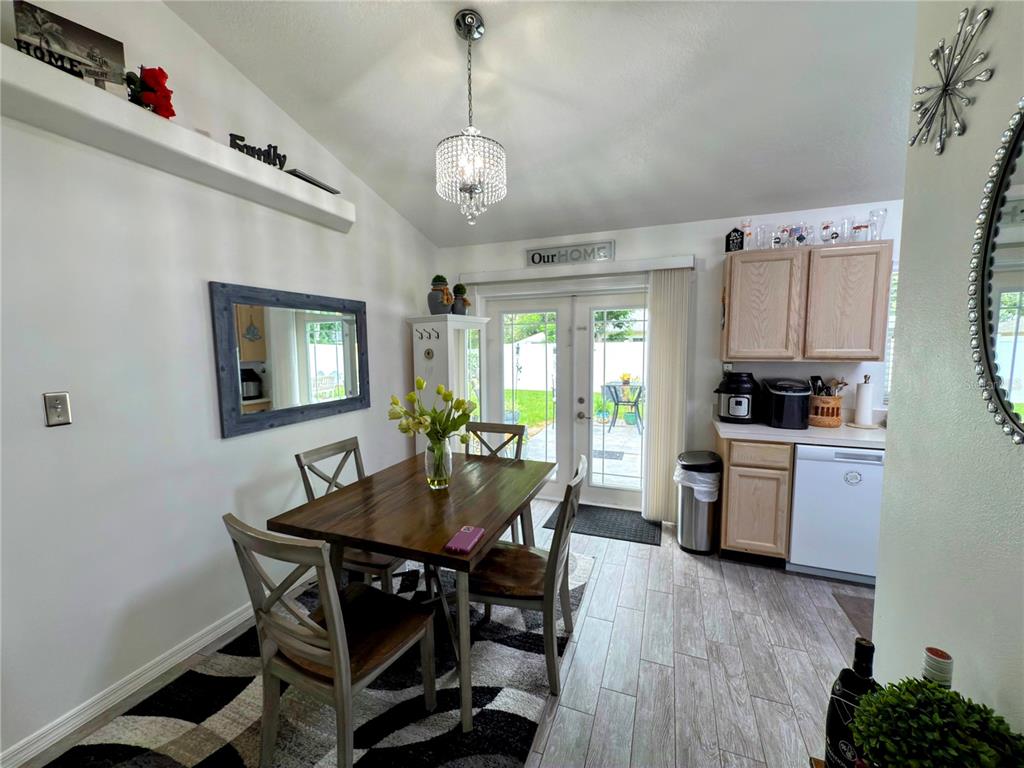 408 Raymond Street Minneola, FL 34715 - Photo 9 of 40 a view of a dining room with furniture window and wooden floor