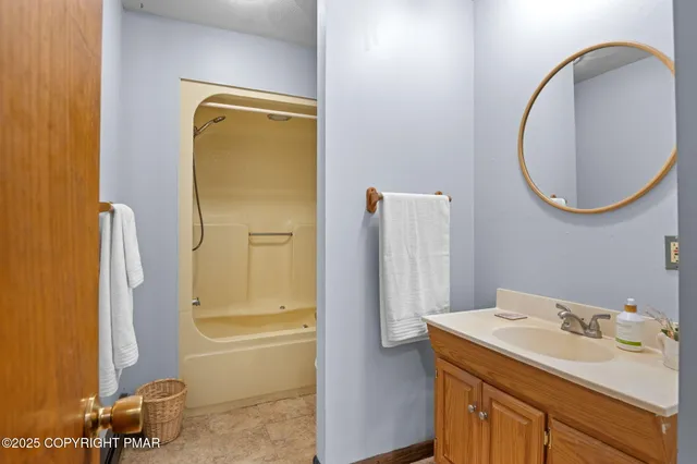 a bedroom with a bed and a tv