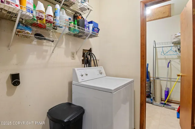 a bedroom with a bed and a television