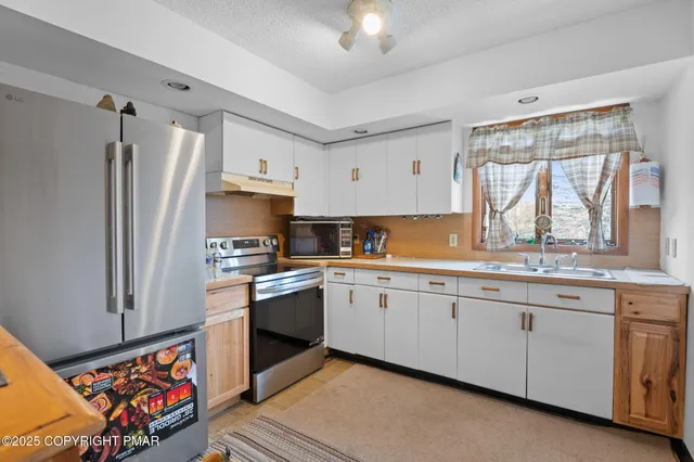 a bathroom with a sink toilet and mirror