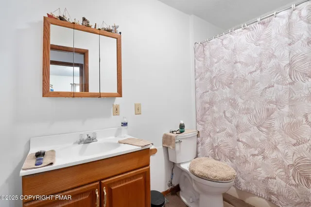 a bedroom with a bed and a desk