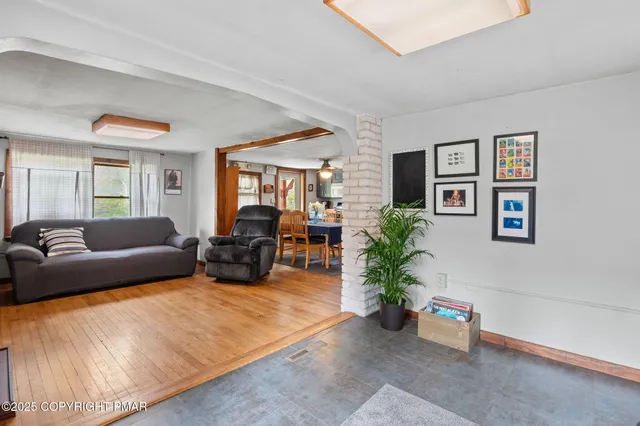 a large bed sitting in a bedroom next to a cabinet