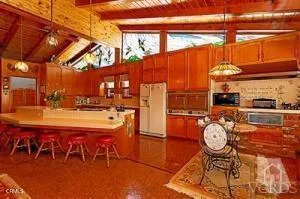 a view of a chairs and table in the patio