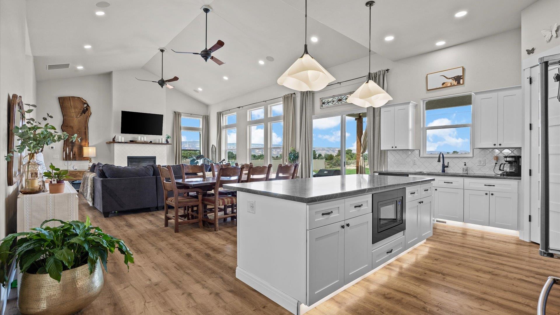 1730 Stremel Creek Fruita, CO 81521 - Photo 11 of 42 a large kitchen with stainless steel appliances a stove center island a window and living room view