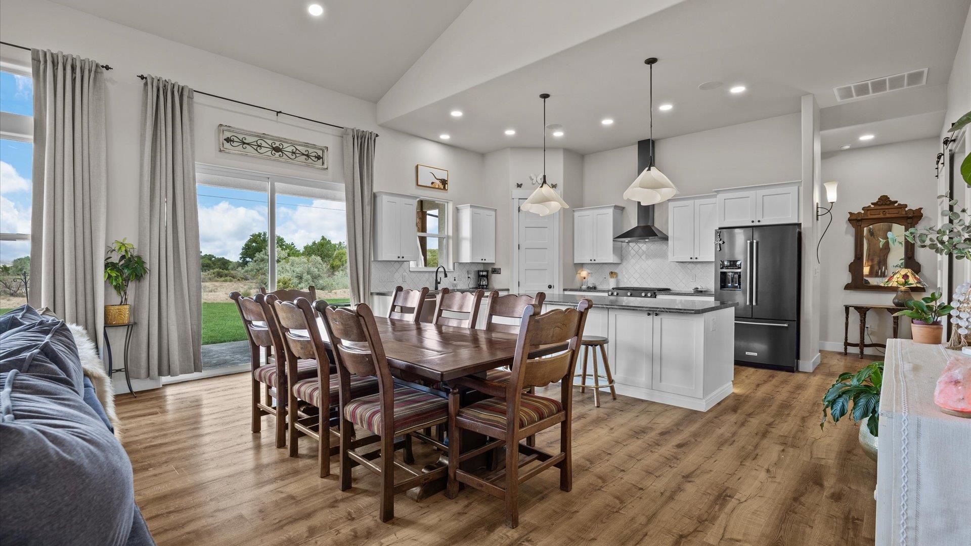 1730 Stremel Creek Fruita, CO 81521 - Photo 16 of 42 a view of a dining room with furniture and wooden floor