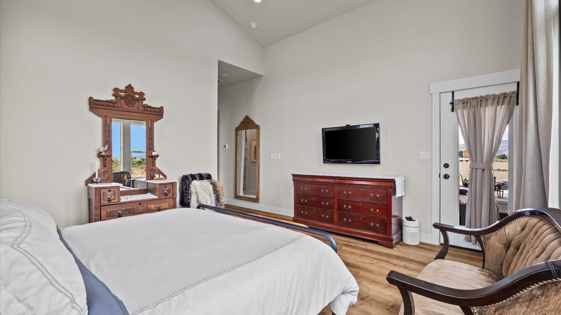 1730 Stremel Creek Fruita, CO 81521 - Photo 18 of 42 a bedroom with a bed and a flat screen tv