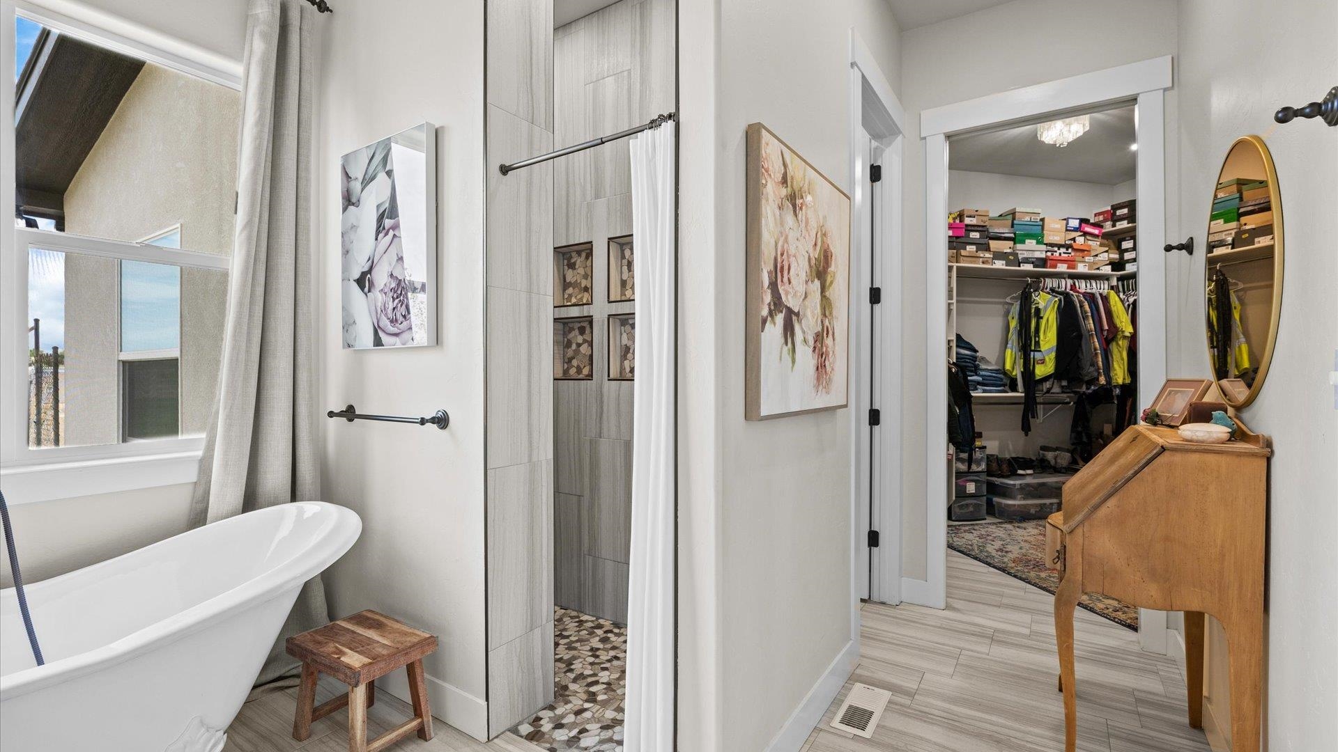 1730 Stremel Creek Fruita, CO 81521 - Photo 21 of 42 a view of walk in closet with clothes and shoes