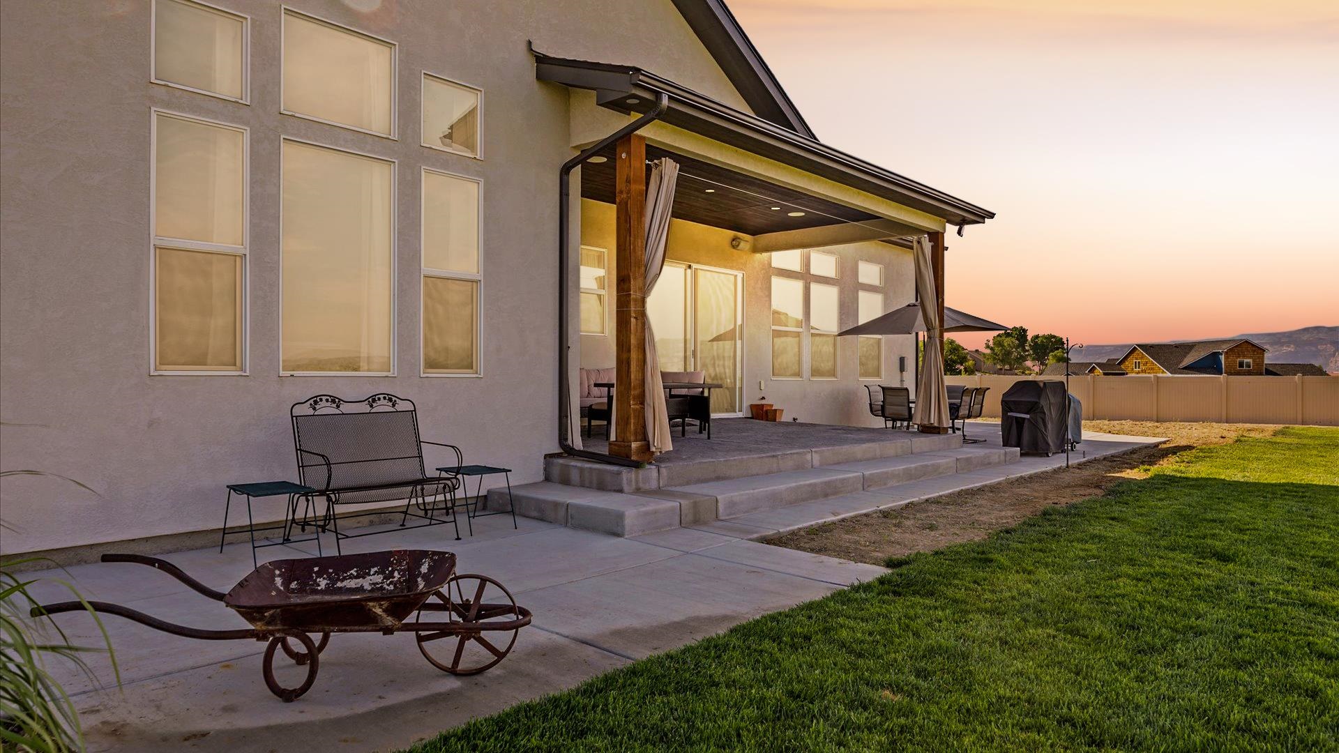 1730 Stremel Creek Fruita, CO 81521 - Photo 29 of 42 a living room with furniture a rug and a floor to ceiling window