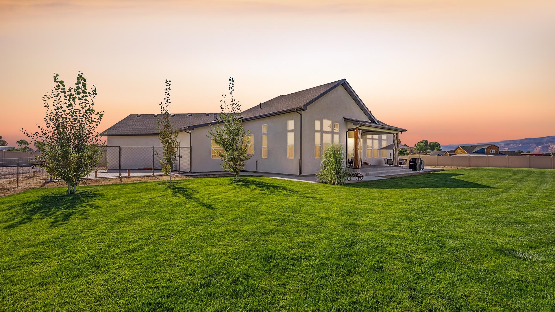 1730 Stremel Creek Fruita, CO 81521 - Photo 31 of 42 a front view of house with yard and green space