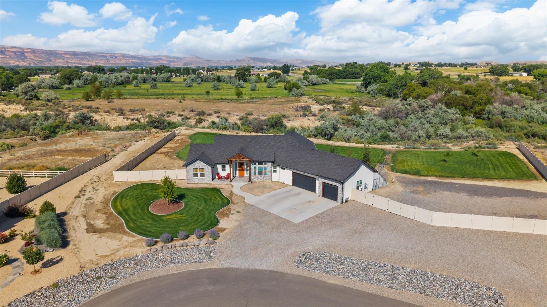 1730 Stremel Creek Fruita, CO 81521 - Photo 42 of 42 an aerial view of a house with a garden and lake view