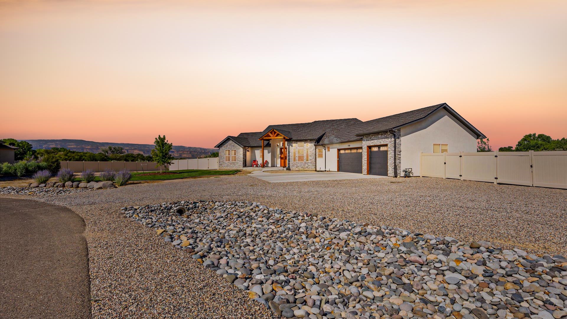 1730 Stremel Creek Fruita, CO 81521 - Photo 5 of 42 a view of a house with a yard