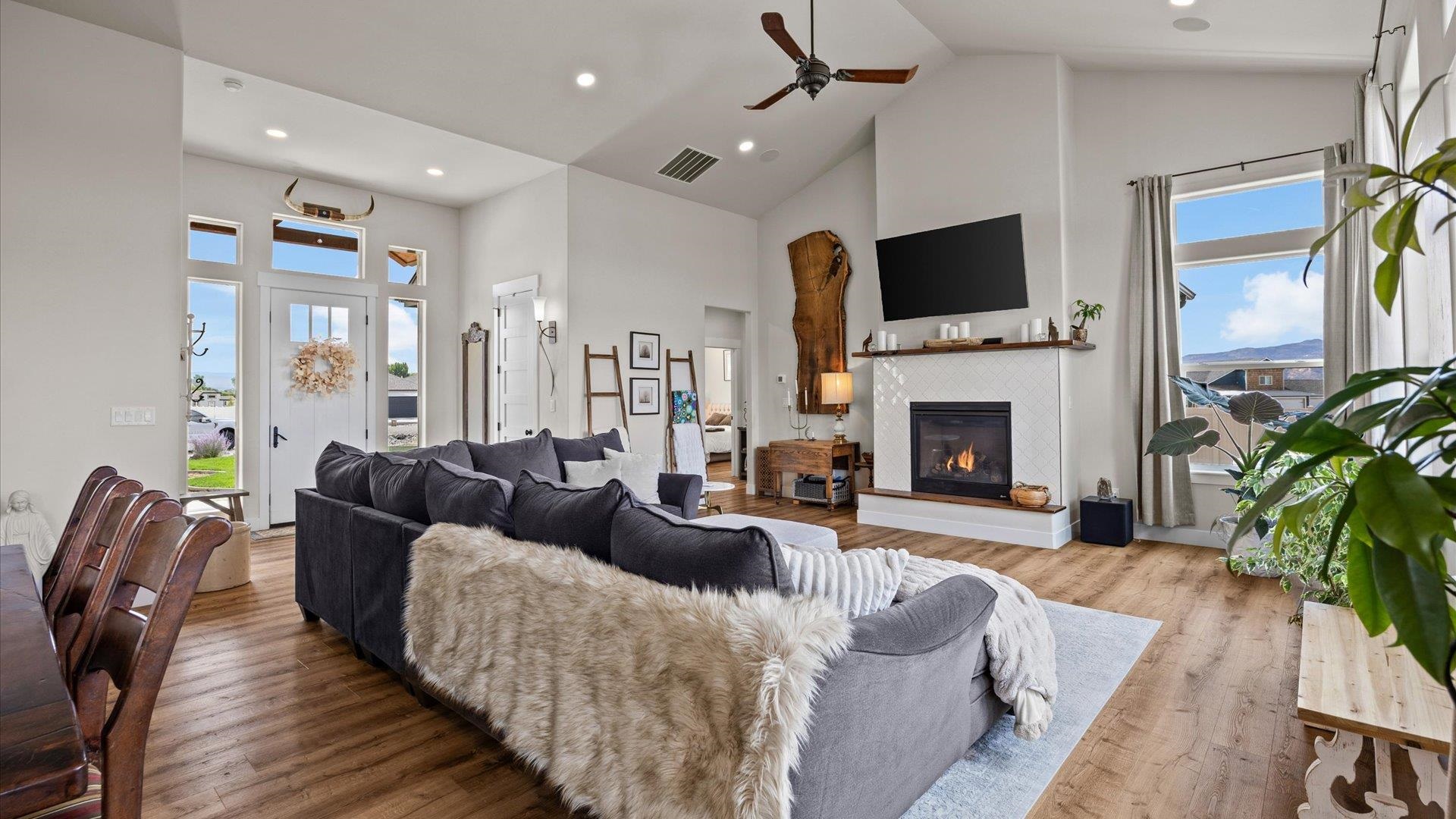 1730 Stremel Creek Fruita, CO 81521 - Photo 8 of 42 a living room with furniture fireplace and flat screen tv