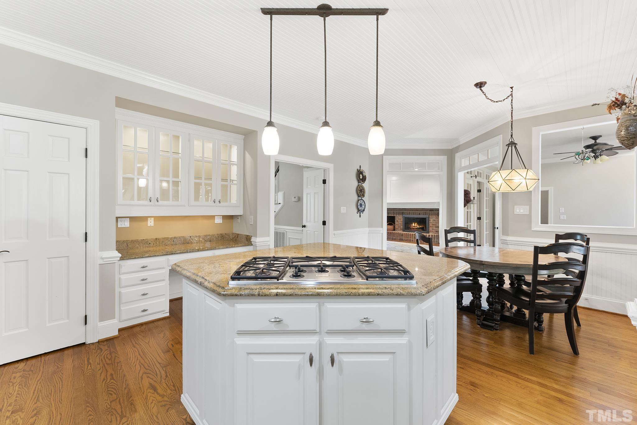 1113 Bentham Drive Raleigh, NC 27614 - Photo 14 of 78 a kitchen with a stove a table and chairs in it