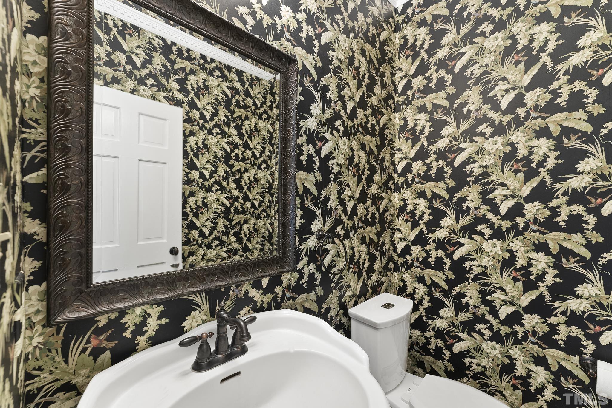 1113 Bentham Drive Raleigh, NC 27614 - Photo 16 of 78 a bathroom with a sink and mirror with toilet